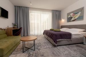 Postel nebo postele na pokoji v ubytování Hotel Nova