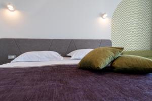 Postel nebo postele na pokoji v ubytování Hotel Nova