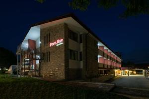 a hotel with a sign on the side of a building at Paradise SPA Hotel in Tsigov Chark