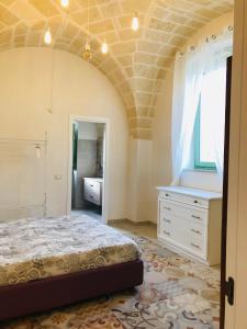 A bed or beds in a room at Le Tre Meraviglie
