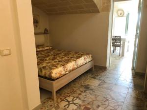 A bed or beds in a room at Le Tre Meraviglie
