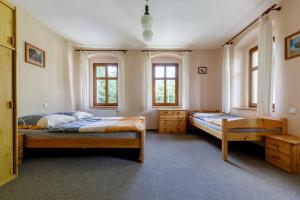 Postel nebo postele na pokoji v ubytování Pod Klínovcem