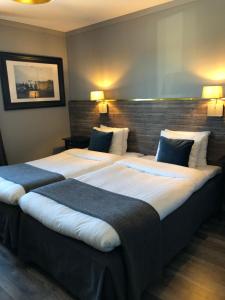 Postel nebo postele na pokoji v ubytování Hotell Älvdalen