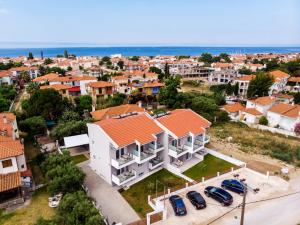 an aerial view of a white house with an orange roof at The PAPOUTSAKIS apartments in Nikiti