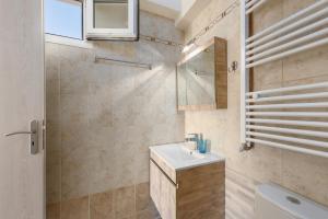 a bathroom with a sink and a shower at Pansion Ermioni in Skala