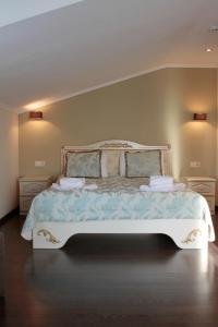 Postel nebo postele na pokoji v ubytování Kolyada Hotel + 37 fotografií