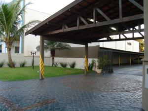 a pavilion with yellow and white ribbons on a patio at Hotel Mirage in Arapongas