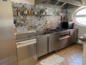 A kitchen or kitchenette at B&B I 4 Sentieri