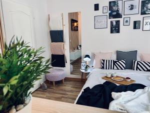 a small bedroom with a bed and a table at Apartment Take a breath in Vrnjačka Banja