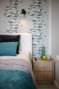 Ένα ή περισσότερα κρεβάτια σε δωμάτιο στο Apartament BLUE Gardenia Dziwnów