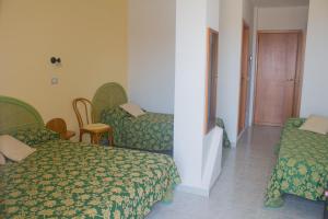Postel nebo postele na pokoji v ubytování Hotel Grotticelle