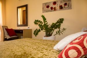 Postel nebo postele na pokoji v ubytování Hotel Grotticelle