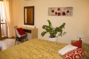 Postel nebo postele na pokoji v ubytování Hotel Grotticelle