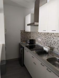 Kuchyň nebo kuchyňský kout v ubytování Apartamentos Albatros