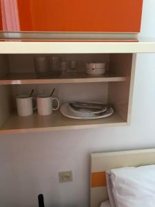 Postel nebo postele na pokoji v ubytování Orange Home Hotel