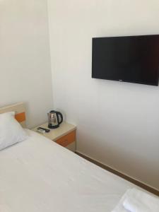 Postel nebo postele na pokoji v ubytování Orange Home Hotel