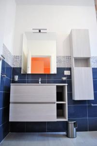 a bathroom with a sink and a mirror at Puteoli house in Pozzuoli