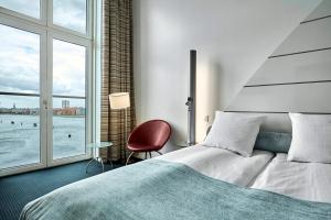Postel nebo postele na pokoji v ubytování Copenhagen Island Hotel + 37 fotografií