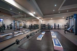 a gym with lots of equipment in a room at Kilmurry Lodge Hotel in Limerick