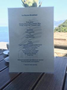 a menu for a restaurant sitting on top of a table at il Magàn - Cinque Terre in Corniglia