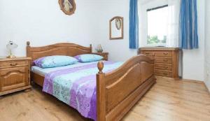 Postel nebo postele na pokoji v ubytování Apartments and Rooms Mišić