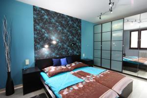 Postel nebo postele na pokoji v ubytování Apartmán 77