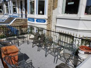 a group of chairs sitting in front of a fence at The Regency Hotel in Blackpool