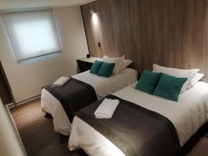 Postel nebo postele na pokoji v ubytování Hotel H9