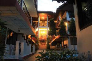 a hallway of a building with stairs and plants at Chaweng Noi Resort in Chaweng Noi Beach