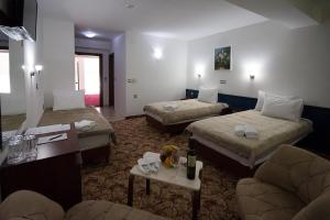 Postel nebo postele na pokoji v ubytování Hotel Nar Gevgelija