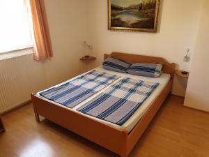 Postel nebo postele na pokoji v ubytování Apartmenthaus Fa