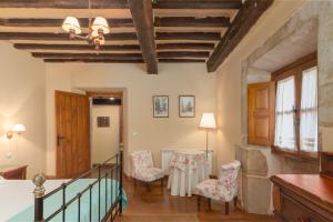 Postel nebo postele na pokoji v ubytování Casona De La Salceda