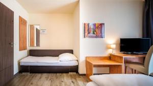 Postel nebo postele na pokoji v ubytování Schroeders City-Style-Hotel
