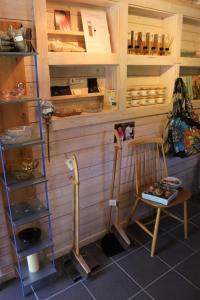 a room with twoadders and a chair and a shelf at Sjöbacken Gård in Lerdala +25 photos