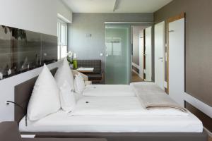 Postel nebo postele na pokoji v ubytování Hotel Freisicht