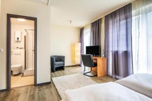 Postel nebo postele na pokoji v ubytování Schroeders City-Style-Hotel