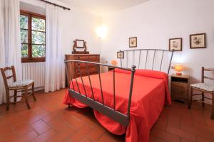 Postel nebo postele na pokoji v ubytování Agriturismo Fattoria di Sommaia