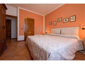 En eller flere senge i et værelse på Agriturismo Ca' Andreana