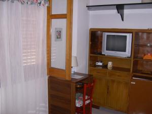 A television and/or entertainment center at Bed & Breakfast 5 Di Spade