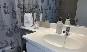 a bathroom with a sink and a mirror at Stay Santiago Lastarria Bellas Artes in Santiago