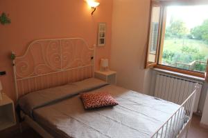 Postel nebo postele na pokoji v ubytování Sul sentiero di Francesco