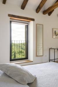 Postel nebo postele na pokoji v ubytování L'Abbraccio della Quercia - Apartments
