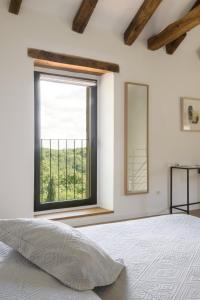 Postel nebo postele na pokoji v ubytování L'abbraccio della quercia