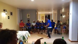 a man standing in a room with a group of people at Cote de France in Fundura