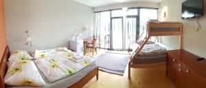 Postel nebo postele na pokoji v ubytování Apartmány Puerto