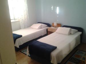 Postel nebo postele na pokoji v ubytování Apartment Mile