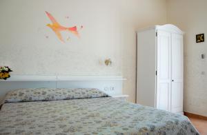 Postel nebo postele na pokoji v ubytování Agriturismo Terra Di Elea azienda agricola di Raimondo MIchela