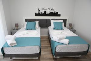 Postel nebo postele na pokoji v ubytování Hotel New York