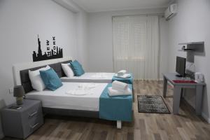 Postel nebo postele na pokoji v ubytování Hotel New York
