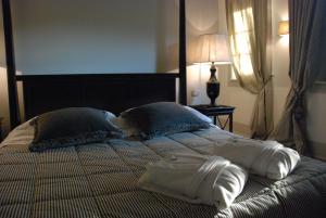A bed or beds in a room at B&B Pieve Degli Artisti